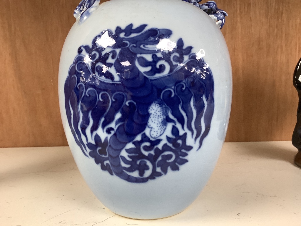 A Chinese blue ground blue and white dragon design vase, 17cm high